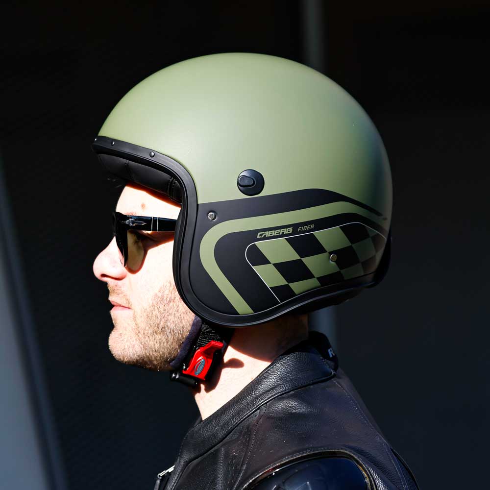 side view of the black and green chequered design of side of motorcycle helmet