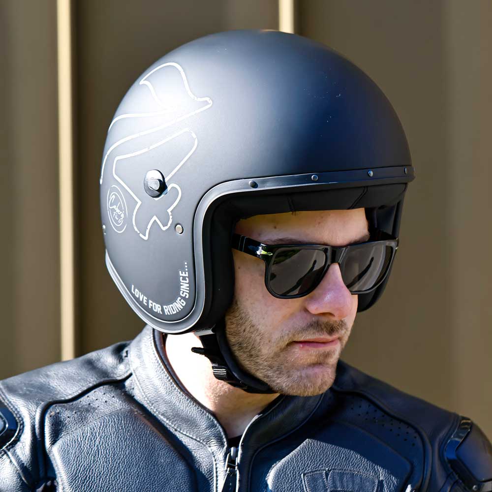 biker wearing black open face motorbike helmet for men with black matching sunglasses