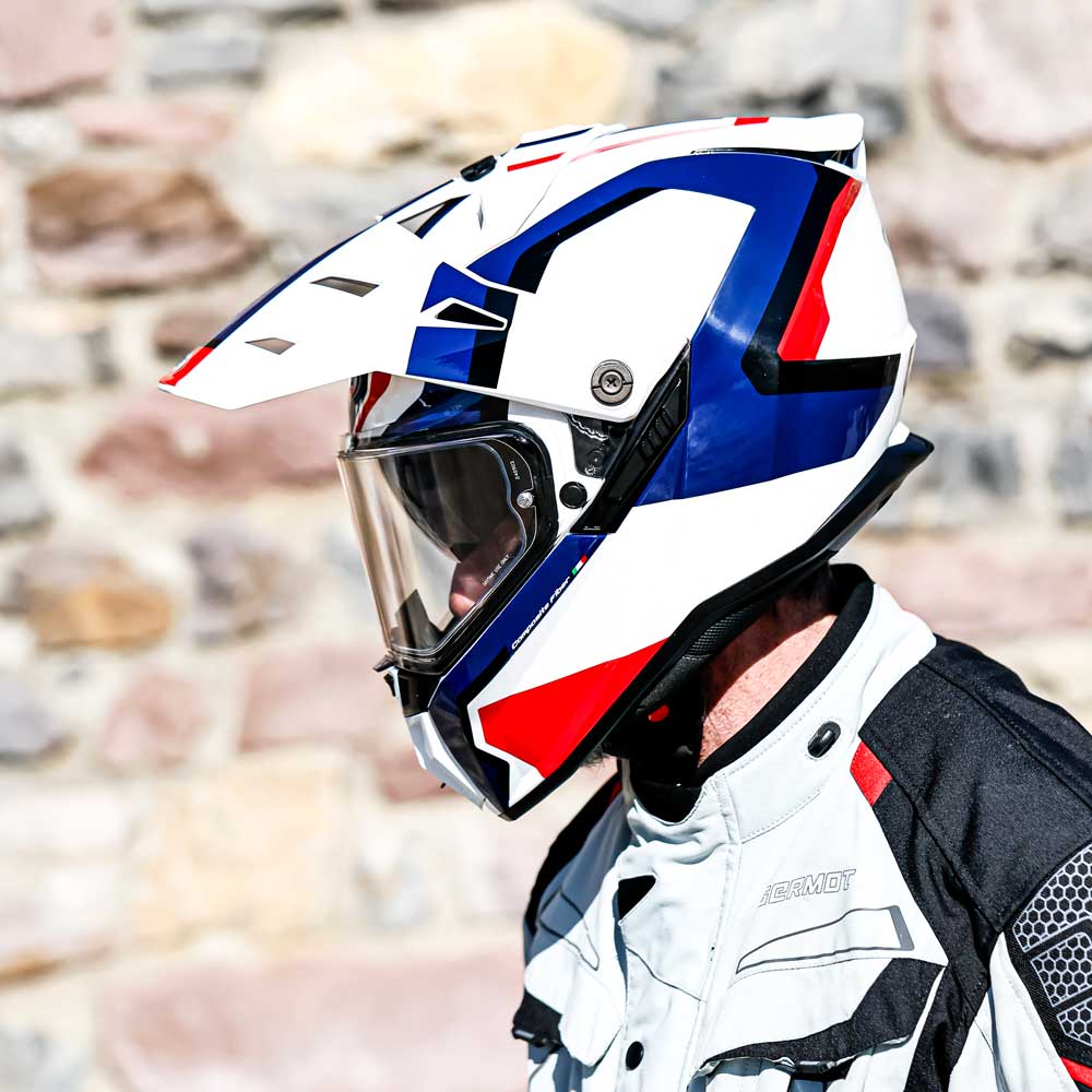 biker wearing blue white and red motorcycle helmet for bikers
