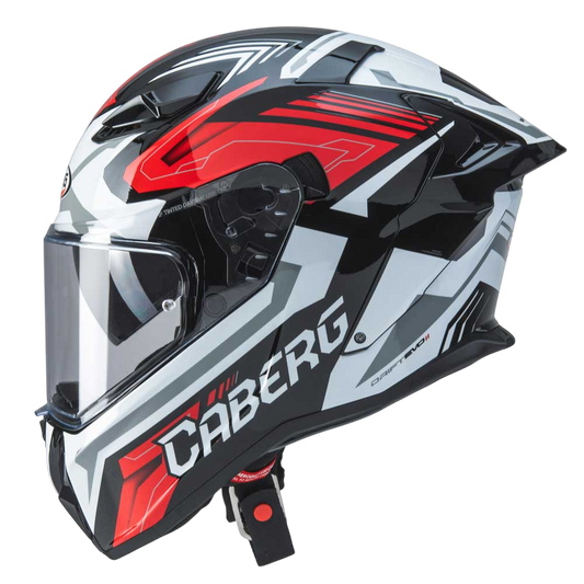 side view of black white and red full face motorbike helmet by caberg