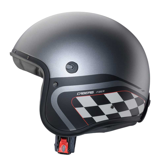 side of grey gun metal motorbike helmet with open face design and checkers in black and white