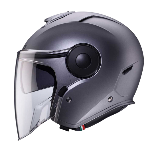 side view of matte gun metal motorbike helmet with clear visor and tinted sun visor